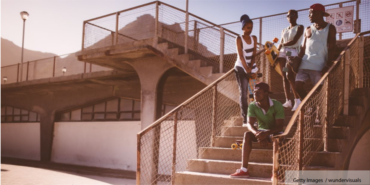 young people hanging out with a skateboard