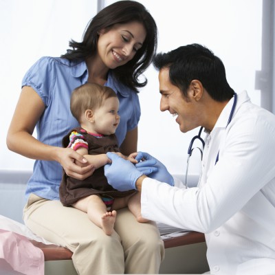 Mother taking child to doctor for routine check up | Shutterstock, Monkey Business Images