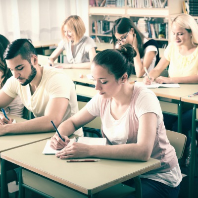Adults in a classroom | Shutterstock, Iakov Filiminov