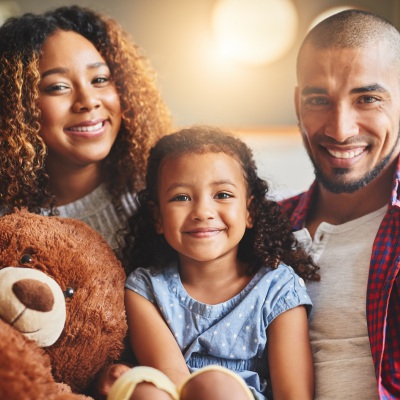 Black Latino Family Smiling  | Getty Images, People Images