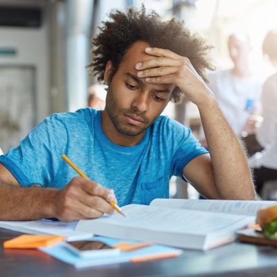 Black Student Studying | Shutterstock, WAYHOME Studio