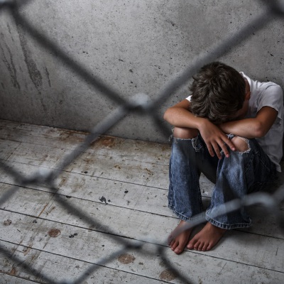 Forlorn_Child_Behind_Fence_Suzanne_Tucker