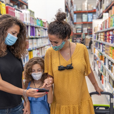 Two Mothers Shopping with Child