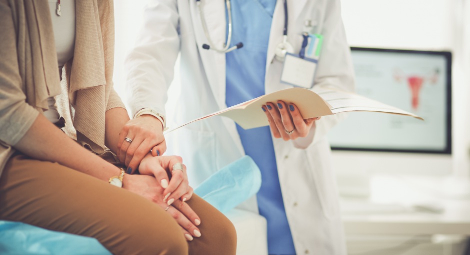 Woman with concerned doctor | Shutterstock, S_L