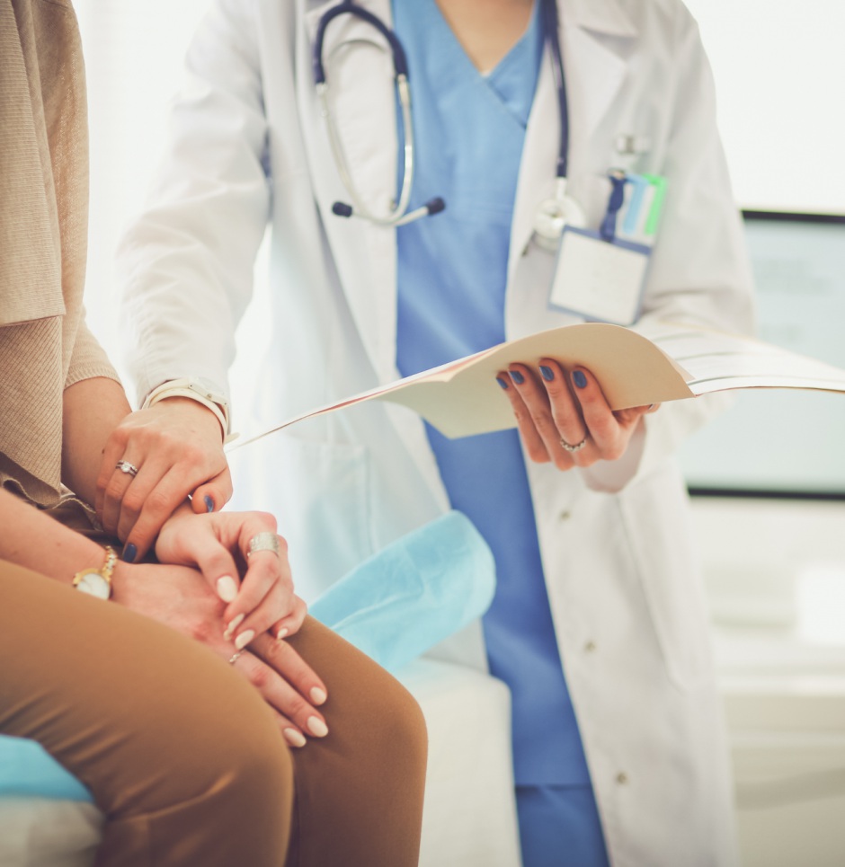 Woman with concerned doctor | Shutterstock, S_L