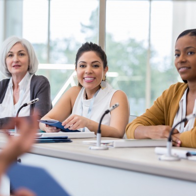 Women presenting at conference