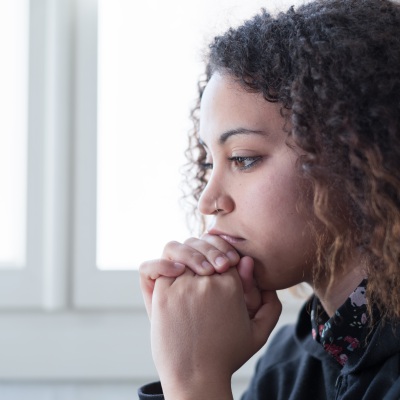 Young African American woman pensive 