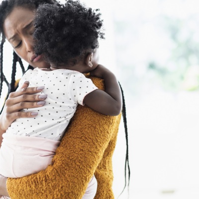 Black Mother Holding Daughter  | Getty Images, JGI / Tom Grill 