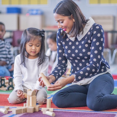 child%20and%20teacher%20playing%20with%20blocks_FatCamera_Getty