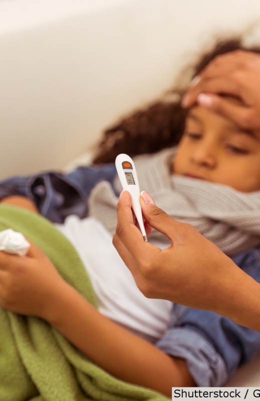 Mother caring for sick child | Shutterstock, George Rudy