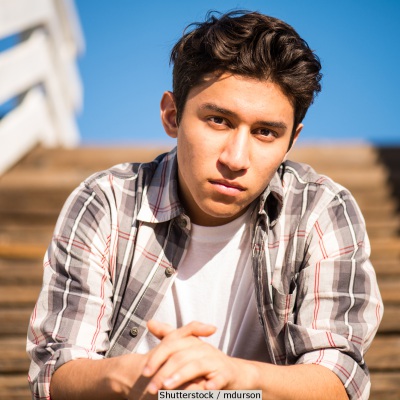 Concerned Hispanic youth | Shutterstock, mdurson