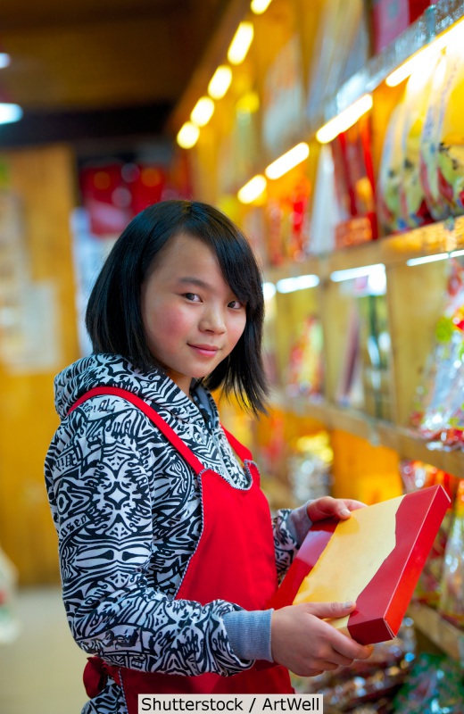 Asian American retail worker | Shutterstock, ArtWell