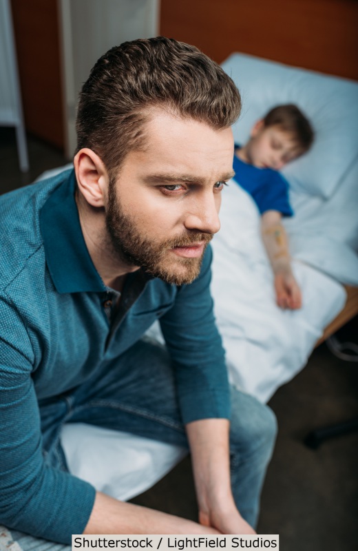 Concerned father beside his son | Shutterstock, LightField Studios