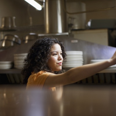 Waitress in Mexican Restaurant | Getty Images
