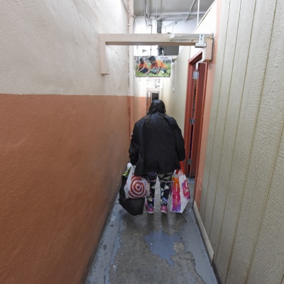 woman with bags of food_Shutterstock_a katz