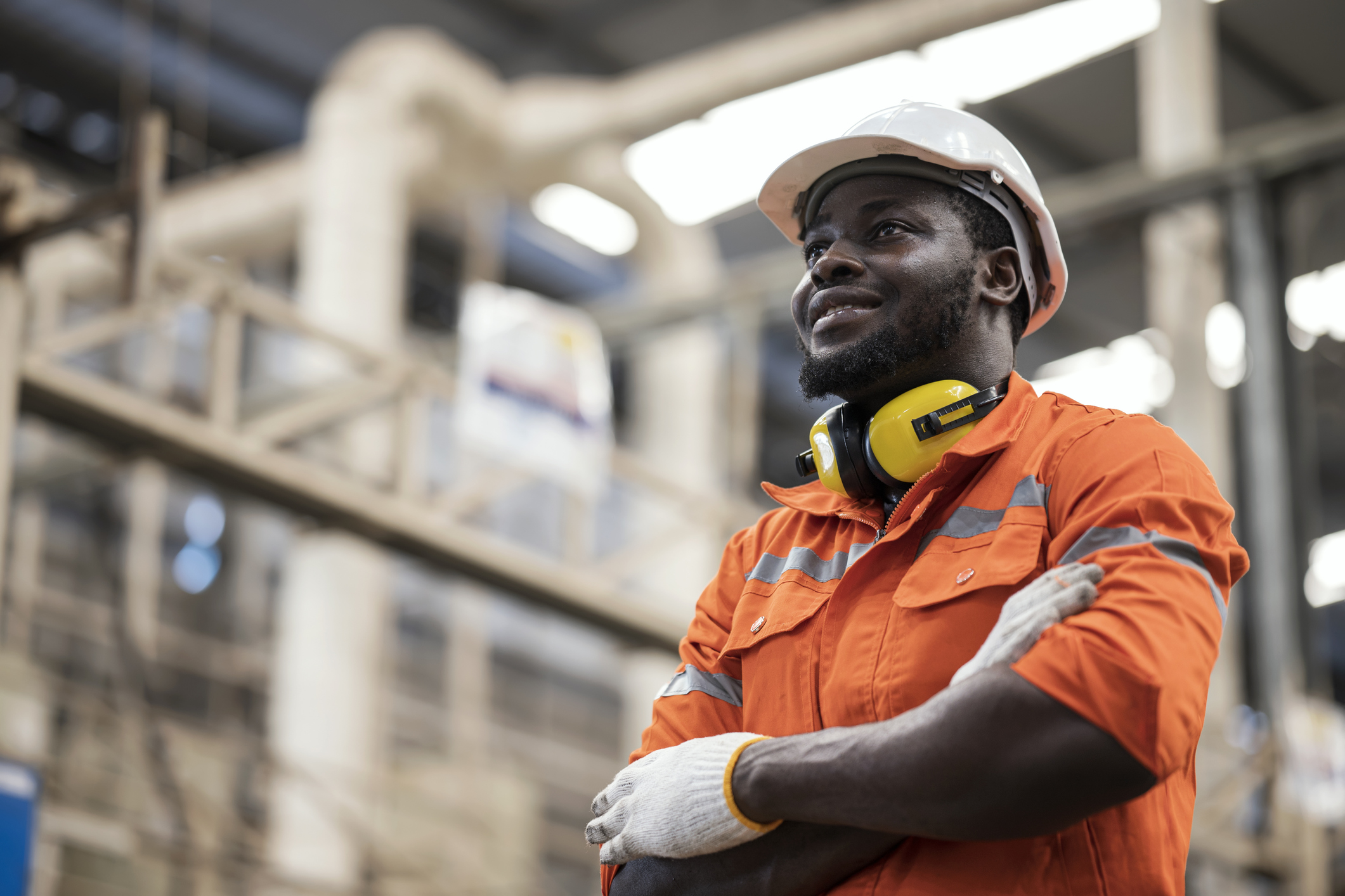 A man working in engineering field looking hopeful. Source: Getty, Nitat Termmee